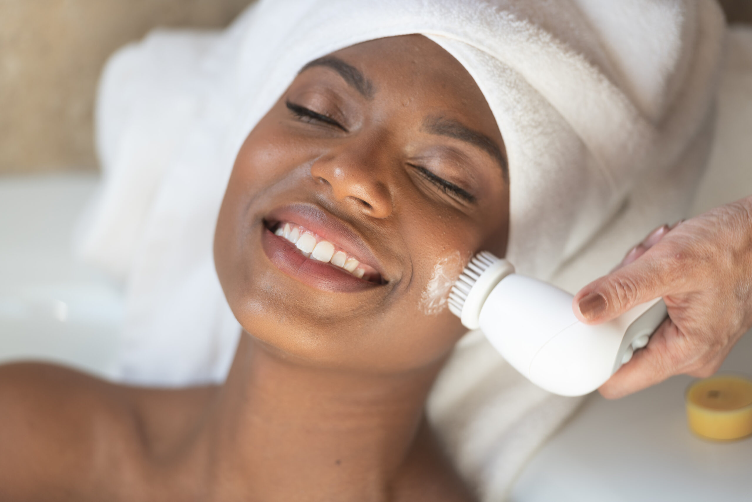 Client receiving corrective facial treatment to improve skin tone and texture at Exhale Skin Studio in Leawood KS