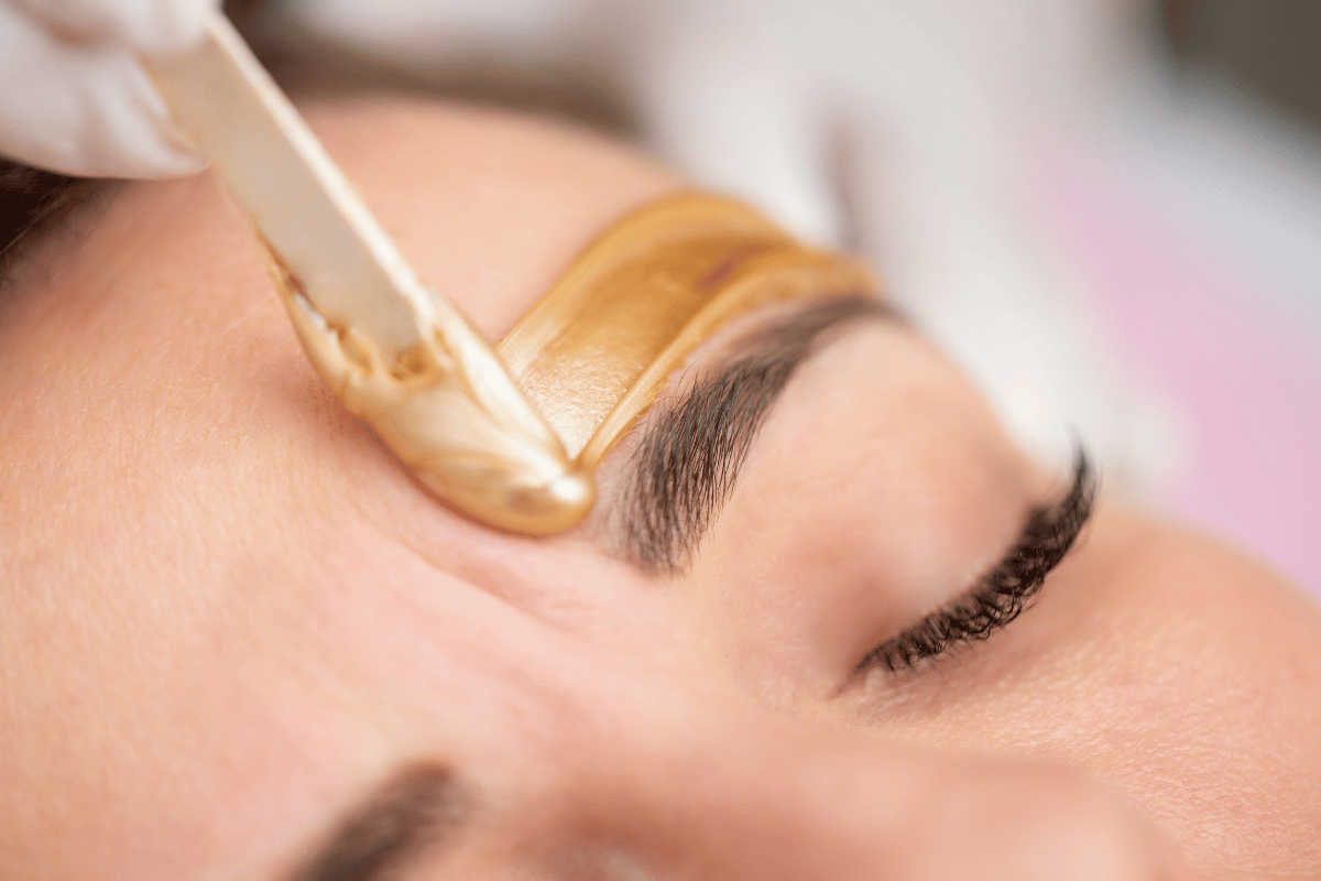 Client receiving professional brow and lash treatment for enhanced definition and natural beauty at Exhale Skin Studio in Leawood KS